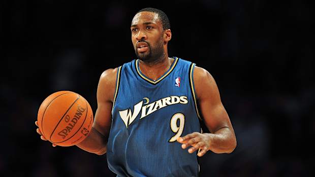 Gilbert Arenas dribbles the ball.